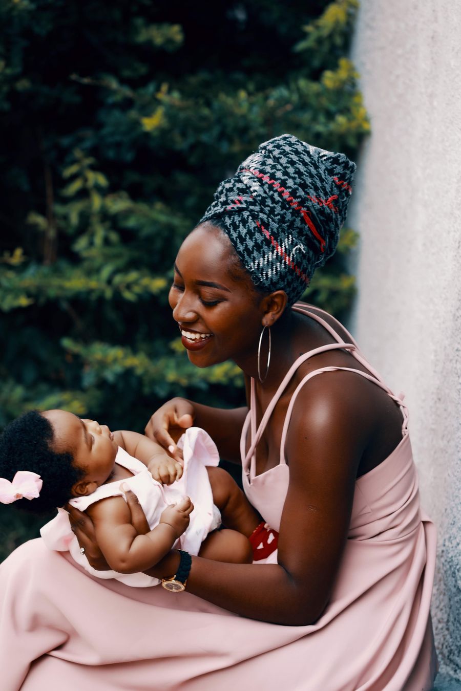 A mother holding her baby close